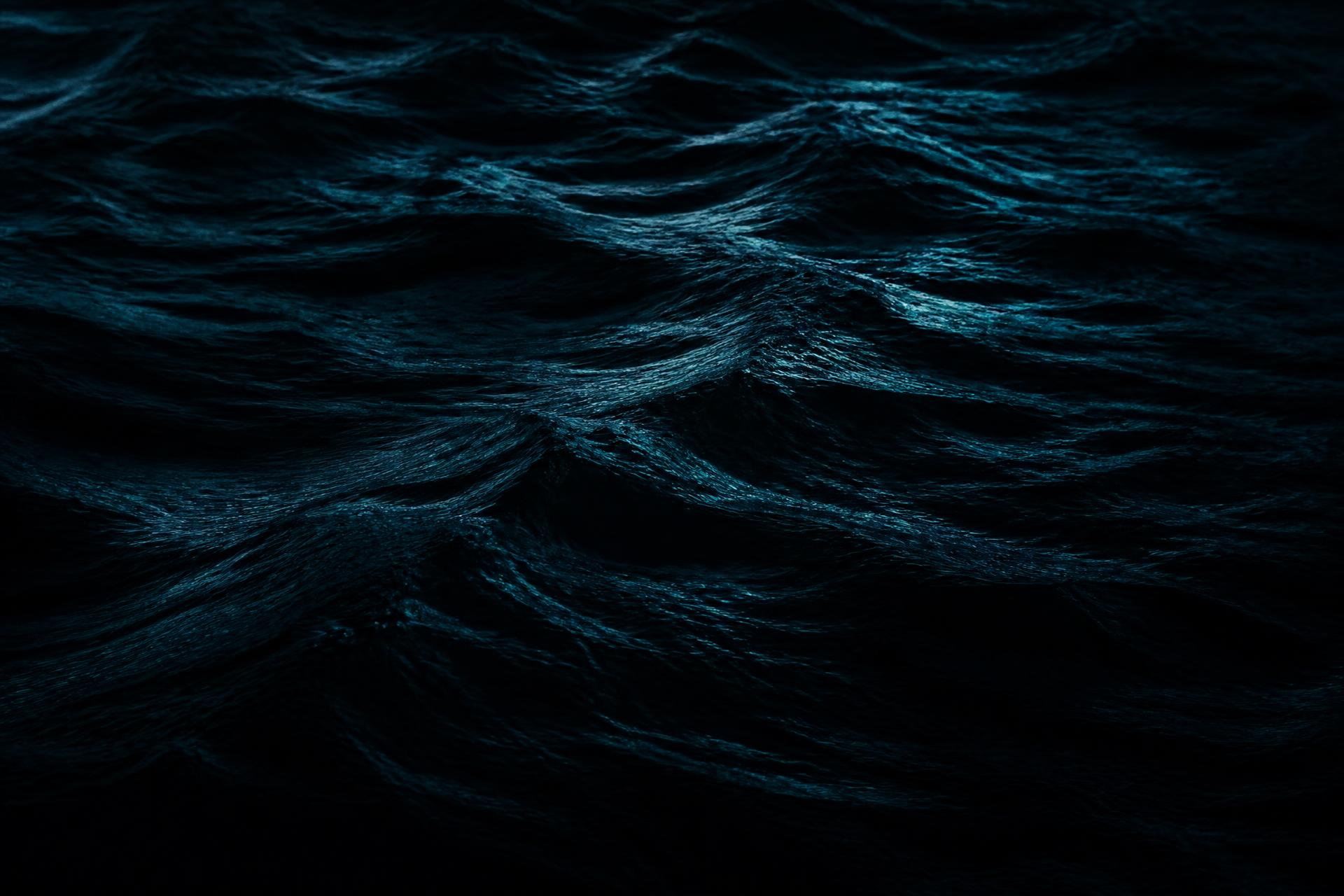 Dark ocean swell texture in near-black navy and deep teal